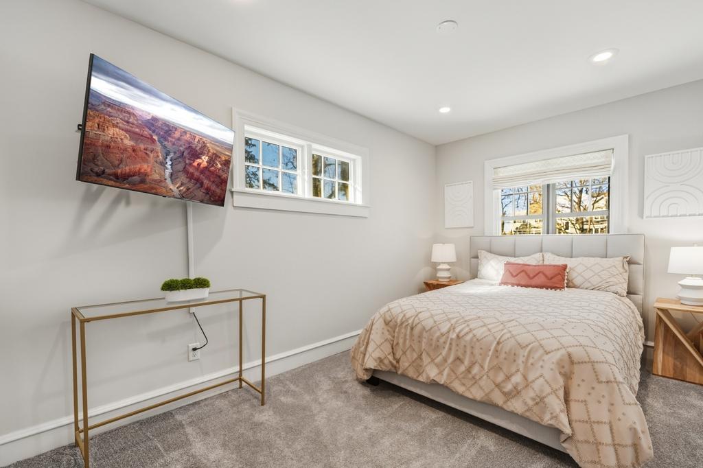Wrapped in natural light, this upper level bedroom is an easy place to unplug at the end of the day.