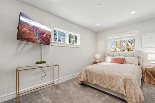 Wrapped in natural light, this upper level bedroom is an easy place to unplug at the end of the day.