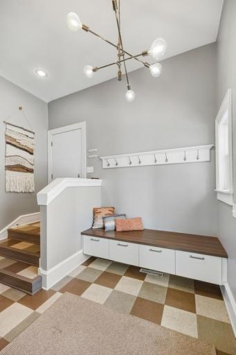 The mudroom creates a clean transition from outside in â a dedicated drop zone that keeps shoes, bags, and lake-day gear organized