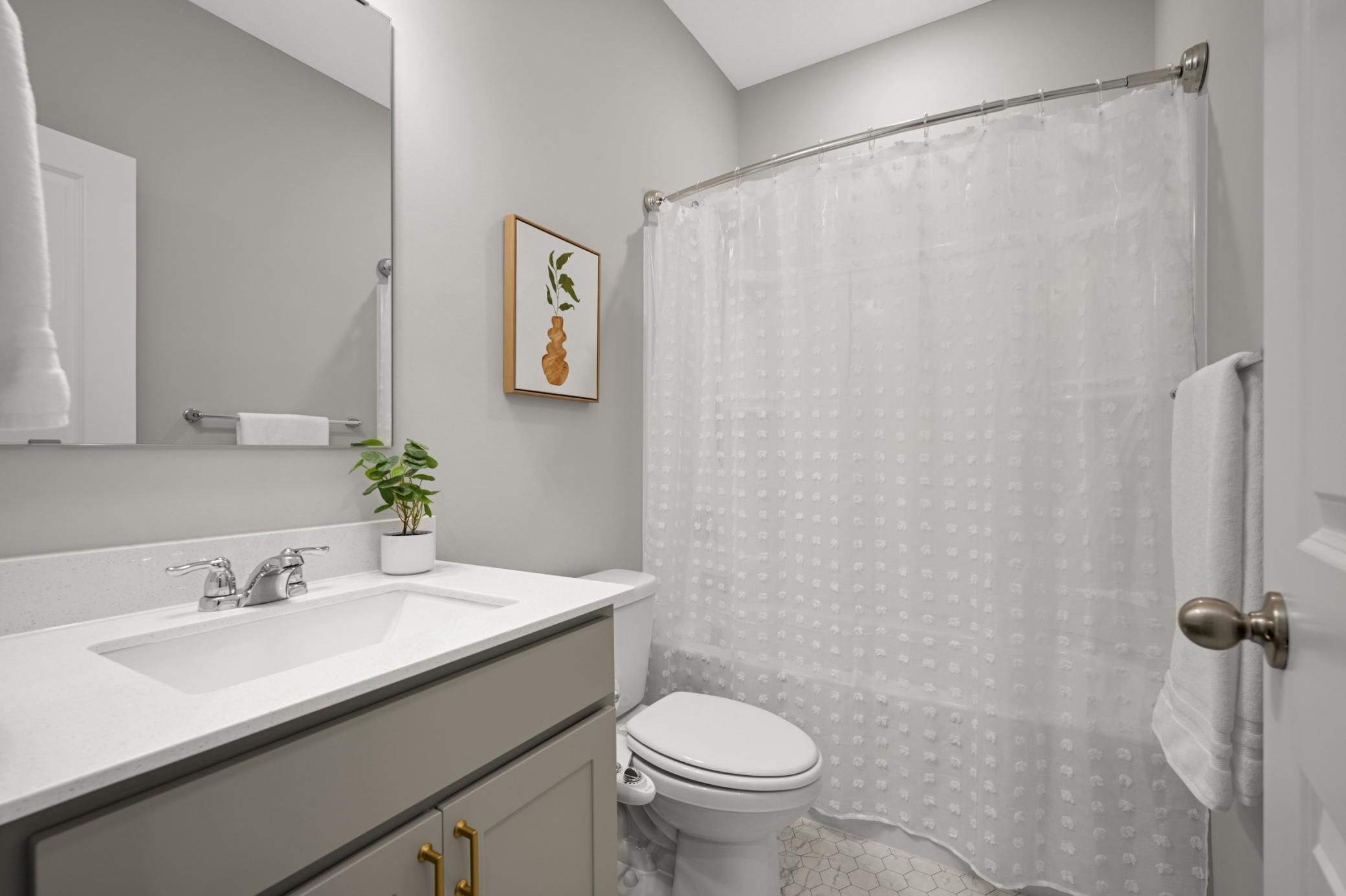 Main floor full bathroom - perfect for guests and working from home