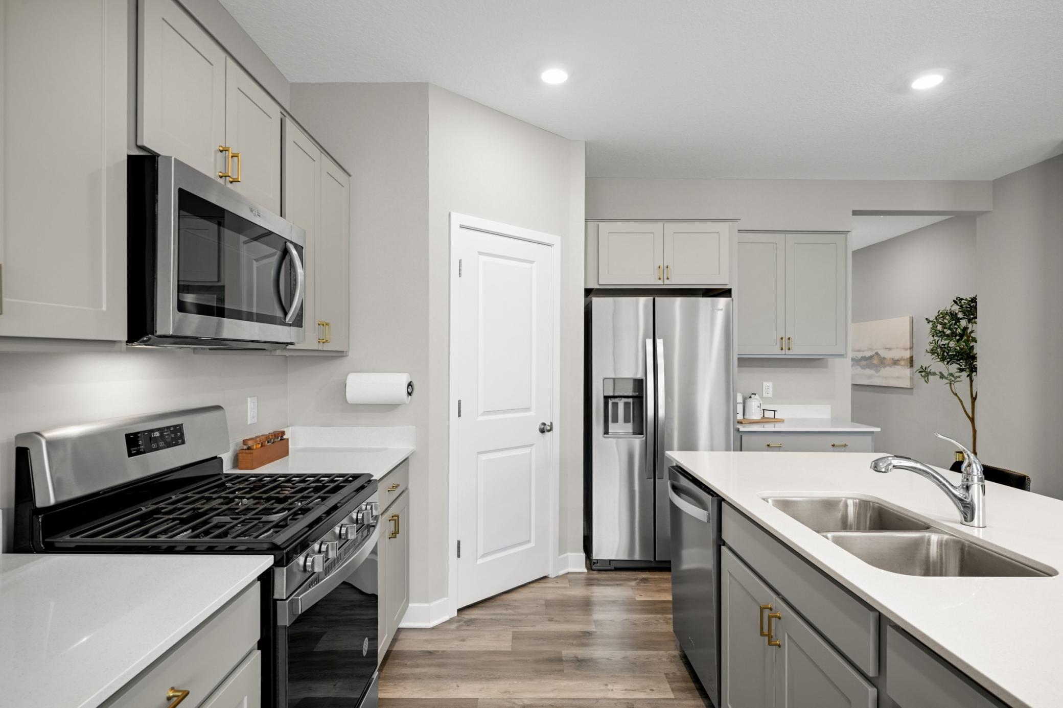 Stainless steel appliances and a gas stove.