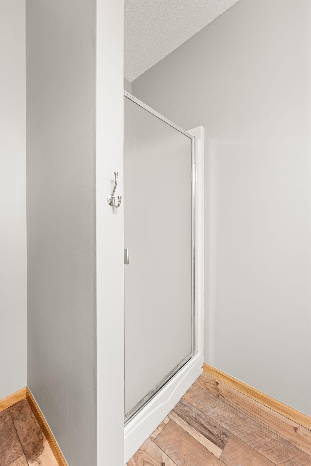 A clean, private shower space designed for ease and everyday comfort.