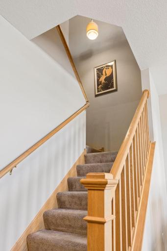 A warm and inviting transition to the upper level, adding to the homeâs open yet defined layout.