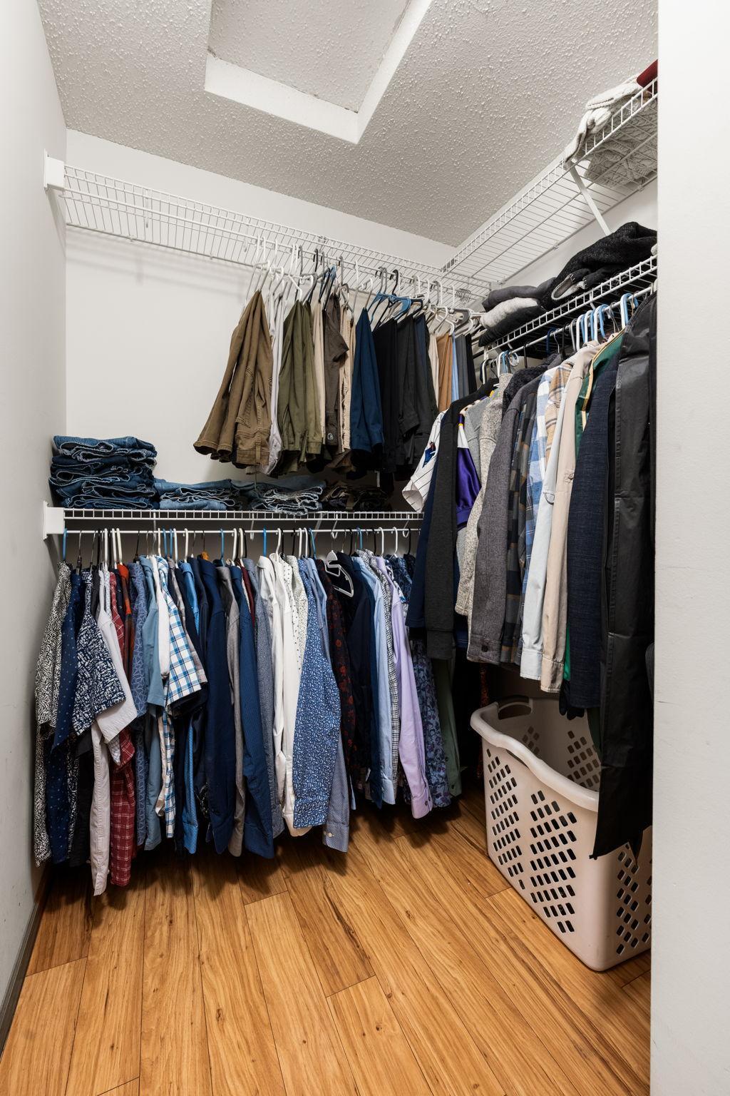 Spacious walk-in closet with built-in shelving—plenty of room to keep everything neatly organized.