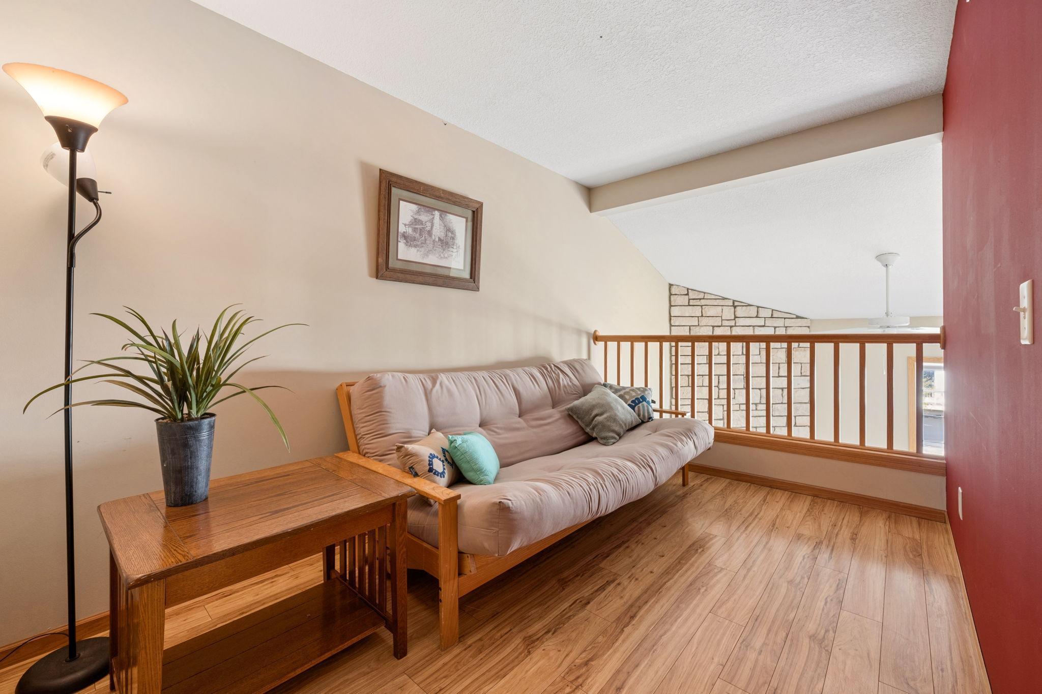 A bright and versatile loft space—perfect for a cozy reading nook, home office, or additional lounge area overlooking the main living space.