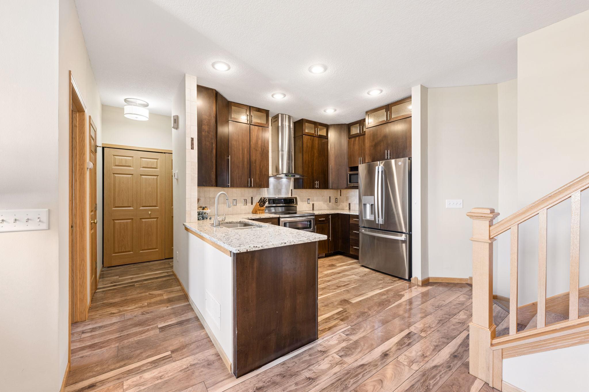 Seamless flow from kitchen into main level bedroom, bathroom and laundry.
