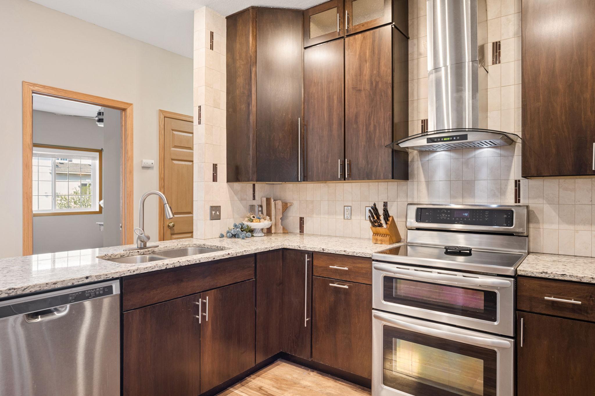 Spacious kitchen with extended counter space and modern finishes, perfect for everyday cooking and entertaining. Open sightlines connect seamlessly to the living area.