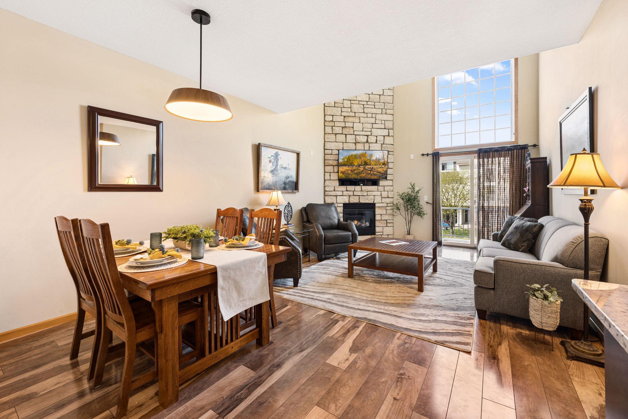 Welcome to 18265 Kerrville Trail Unit 309! Bright, open-concept living and dining space with vaulted ceilings and a stunning floor-to-ceiling stone fireplace. Large windows and sliding door fill the home with natural light.