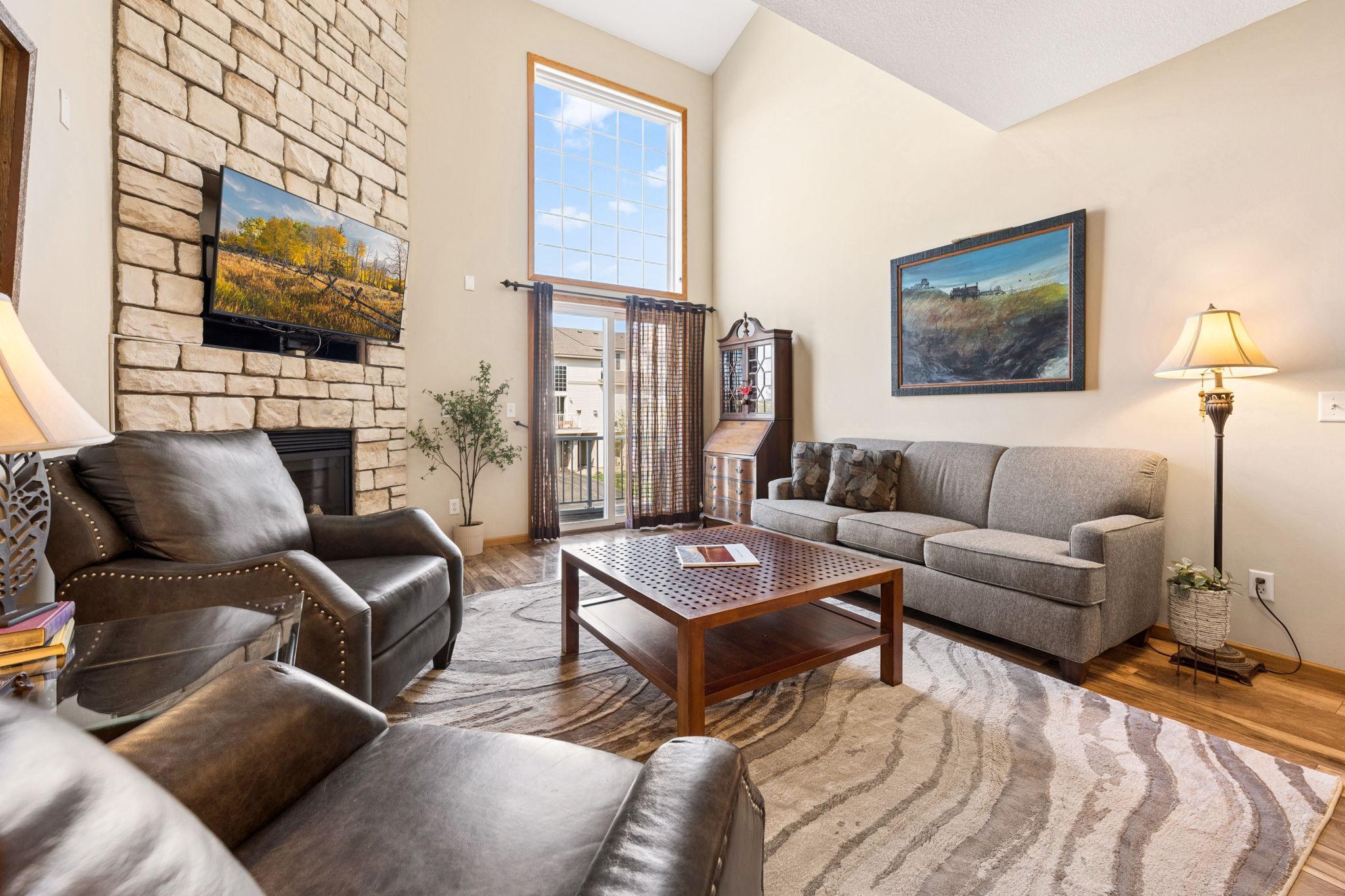 Comfortable living area with great natural light and an open feel. Sliding door leads to a private outdoor deck.