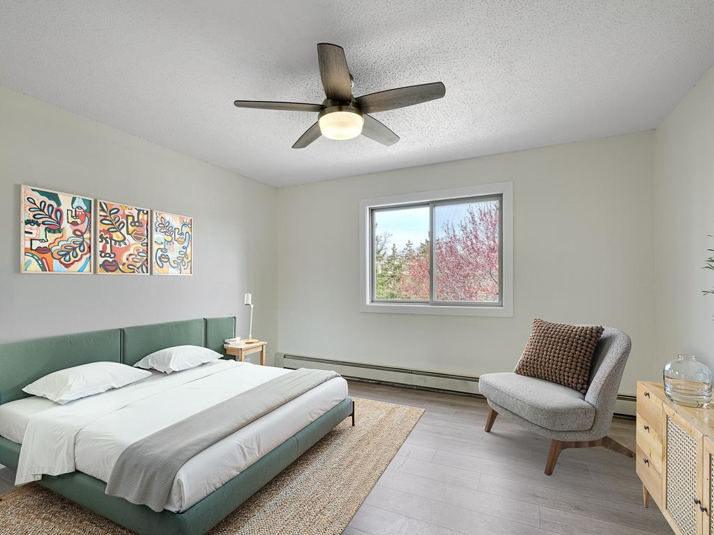 A spacious bedroom with a large closet. (Virtually Staged)