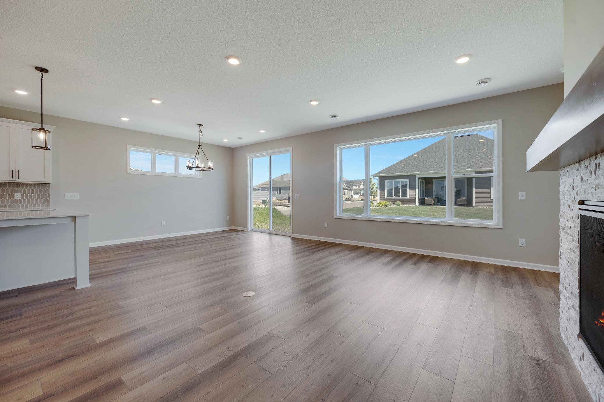 Living room looking towards dining. Photo of similar home. Not actual home. Styles and finishes will vary.