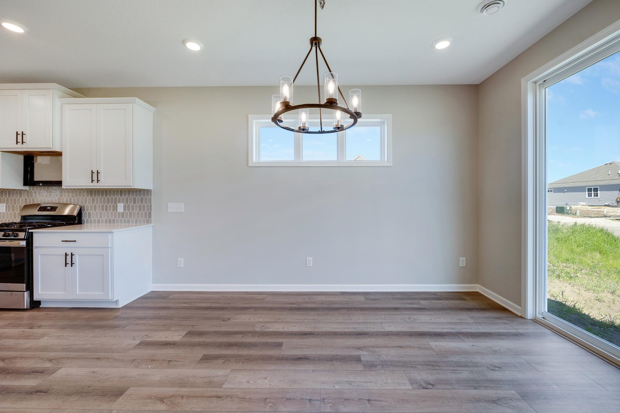 Dining area.Photo of similar home. Not actual home. Styles and finishes will vary.
