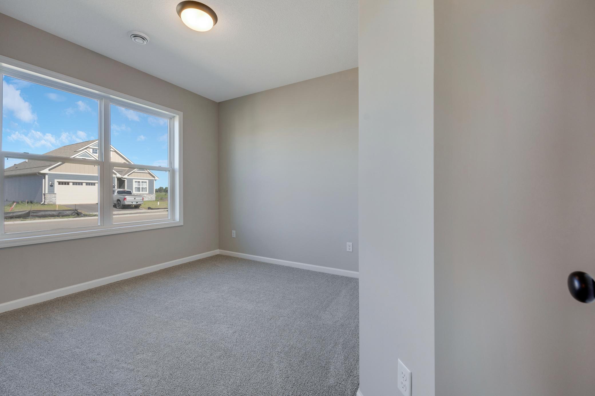 Bedroom 2. Photo of similar home. Not actual home. Styles and finishes will vary.