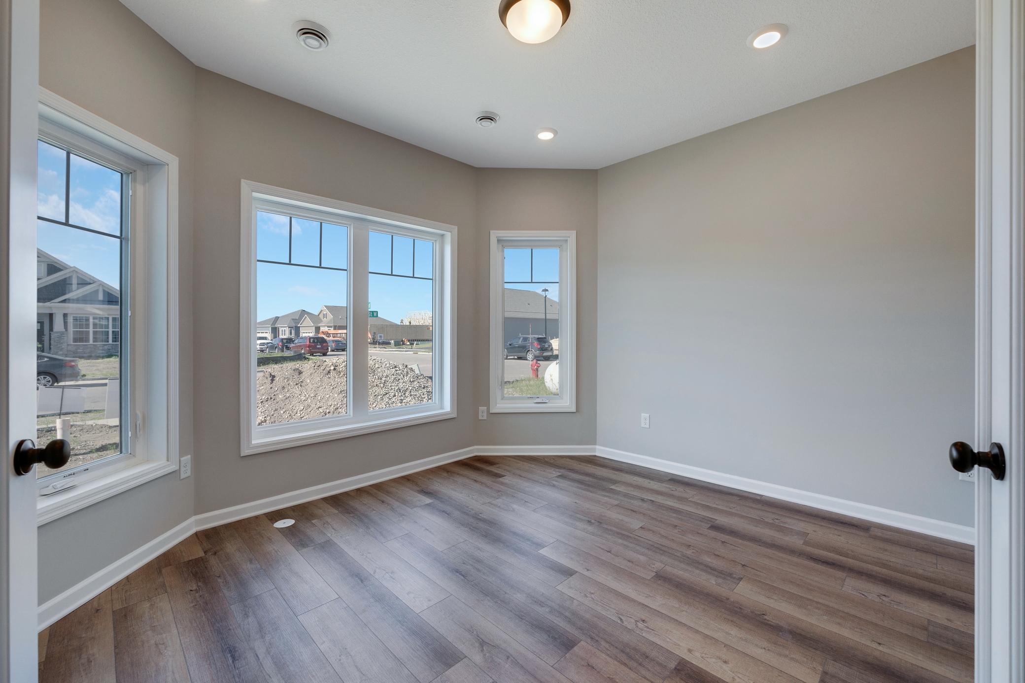 Front flex room. Great space for home office or relaxation! Photo of similar home. Not actual home. Styles and finishes will vary.