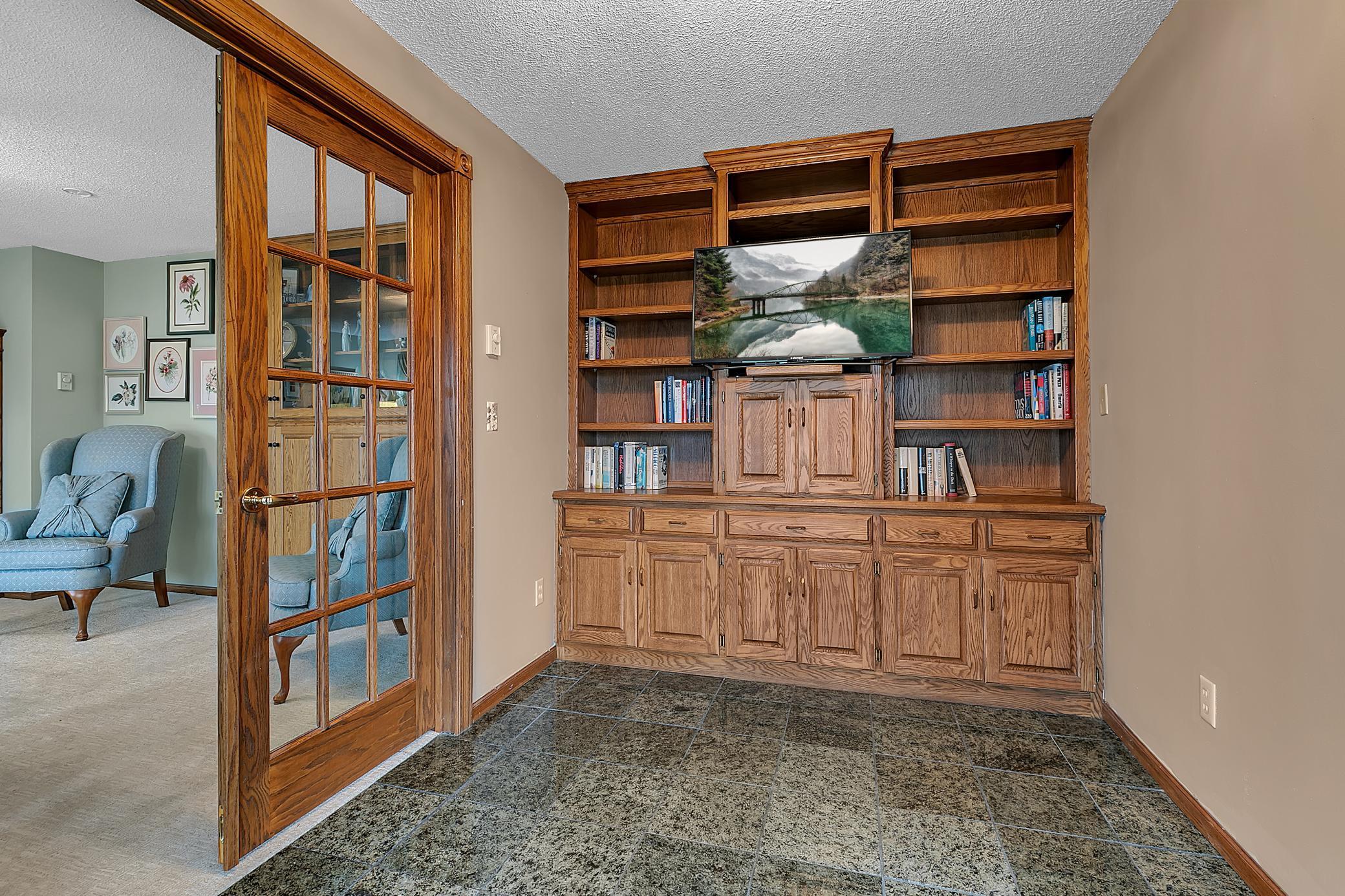 There is a built in for more great storage. This room could be a den, craft room, playroom, or anything you would like.