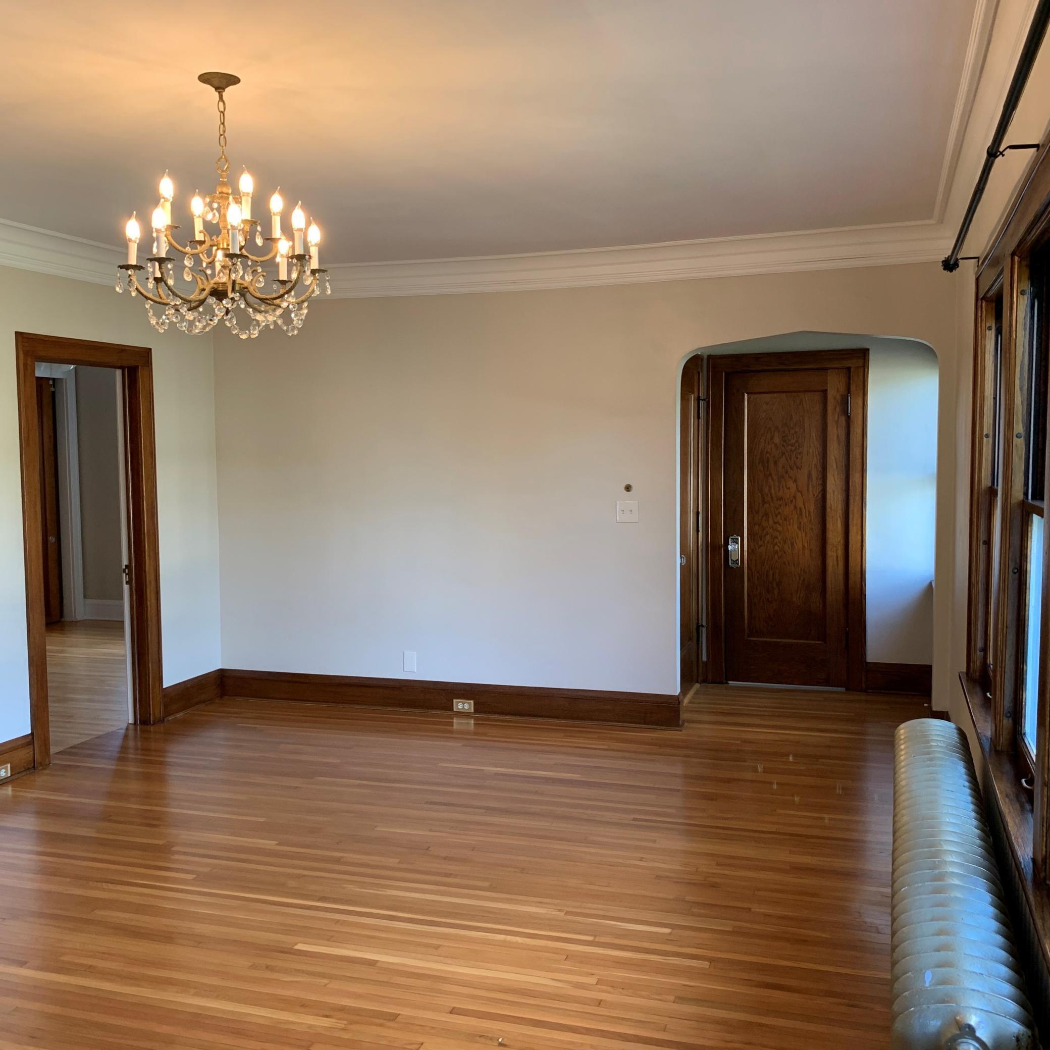 Unit 2 Living Room with Beautifully Restored Wood Floors.jpg