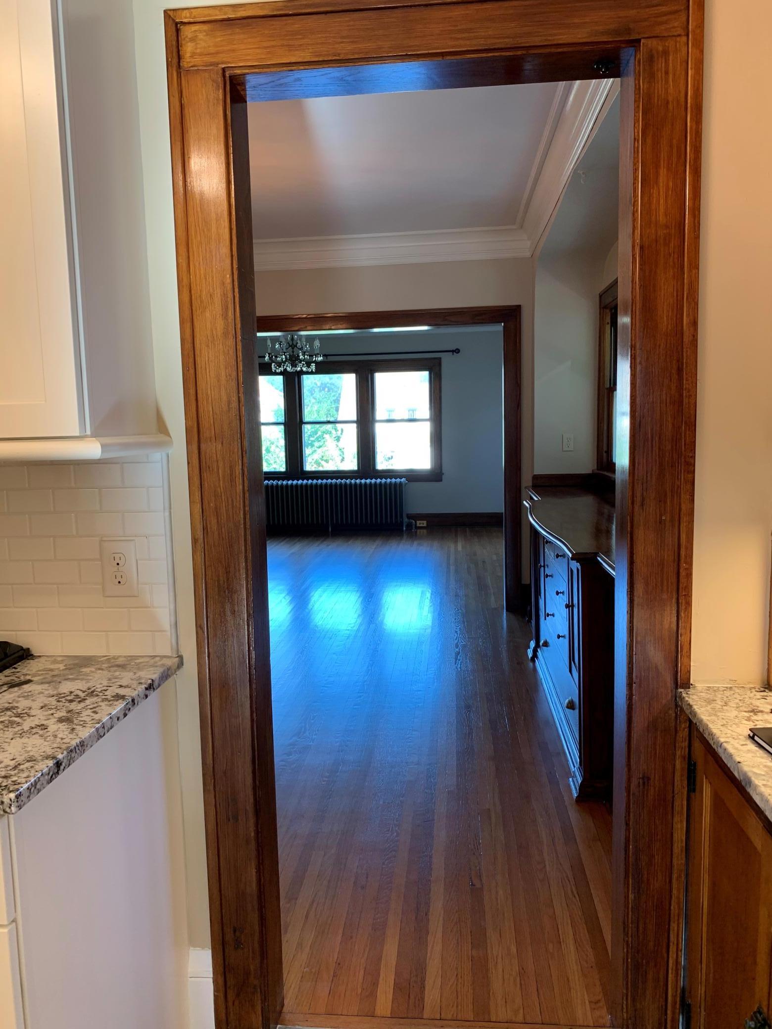Unit 2 View from Kitchen Door Through Dining Room to Living Room.jpg