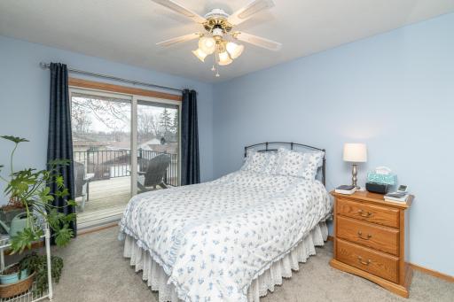 Primary bedroom with patio door to private deck