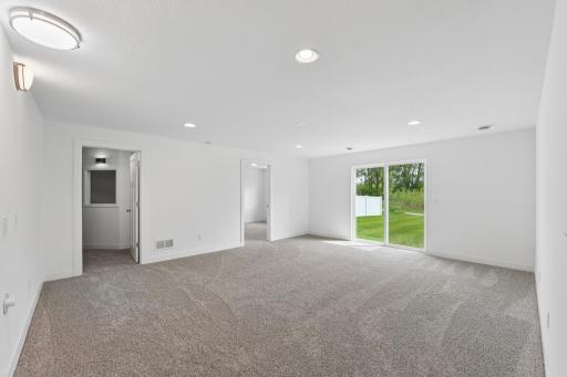 The recently finished walk-out lower level offers another living area, 3 additional bedrooms, a theater room, and a 3/4 bath.