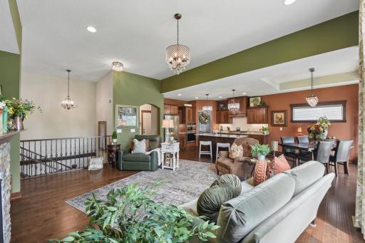 Enjoy the upgrades throughout this home including the hardwood floors, light fixtures, and archway accents.
