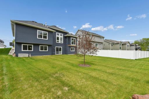 The backyard offers space for a future deck, walk-out patio, and so many activities with the flat lot.