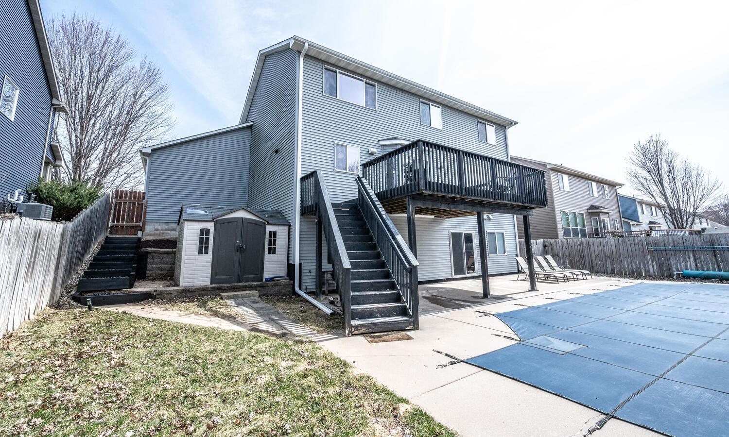 1122 Drew Dr Woodbury MN 55129-large-005-028-Back of Home-1500x900-72dpi.jpg