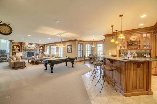Designed for exceptional entertaining, the walkout lower level offers a true destination experience. Social center (virtually staged)