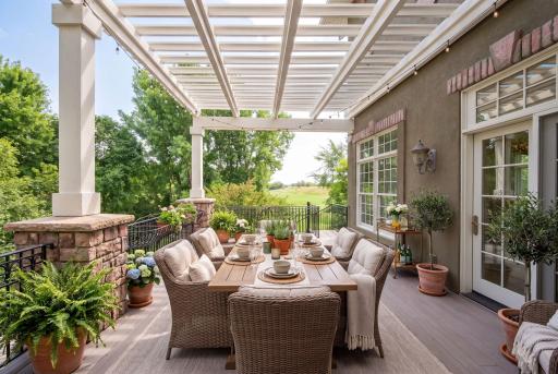 Deck above patio off of sun room (virtually staged)