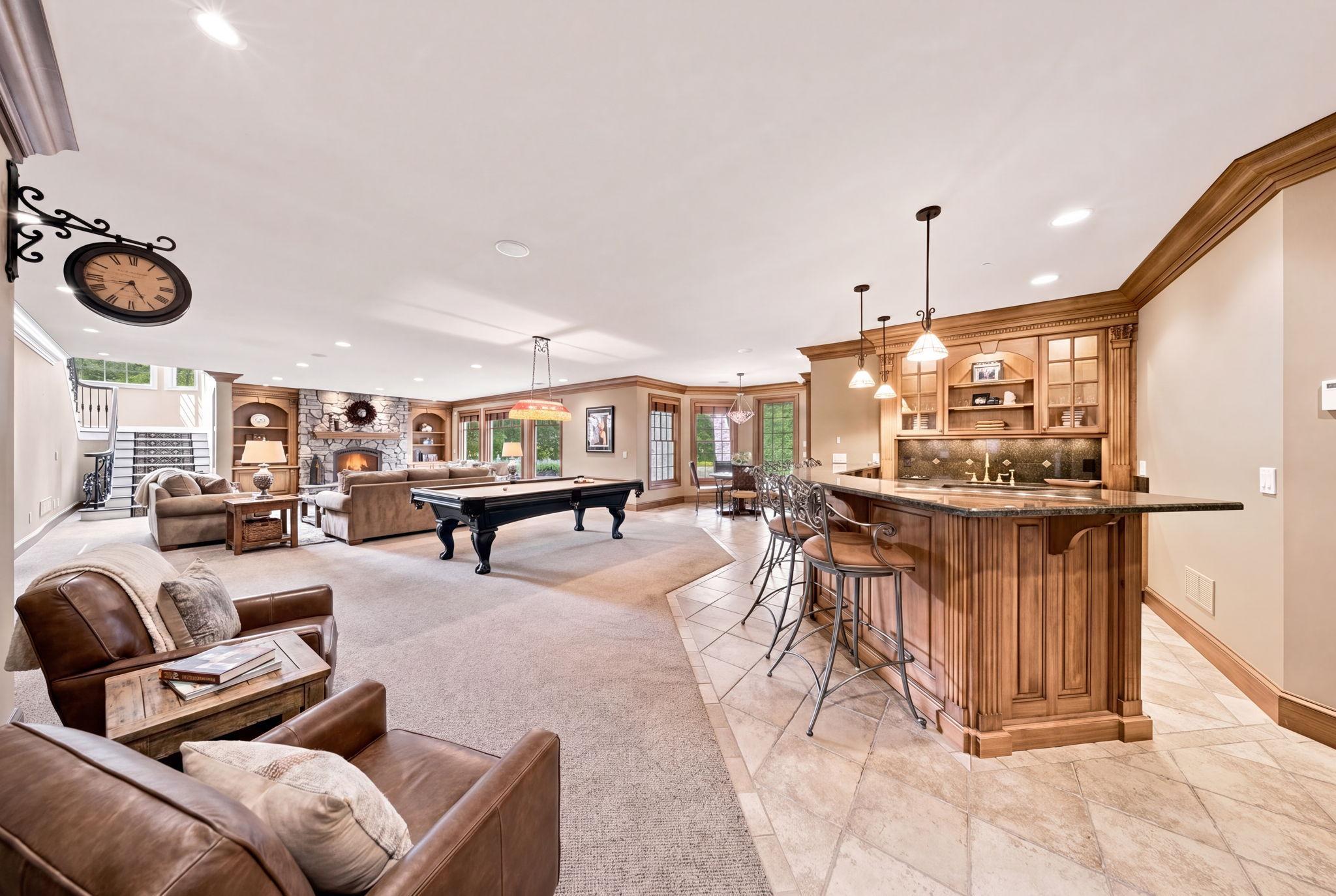 Designed for exceptional entertaining, the walkout lower level offers a true destination experience. Social center (virtually staged)