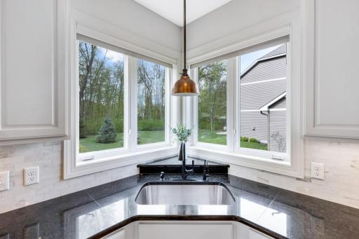 Large sink with windows to bring in tons of natural light