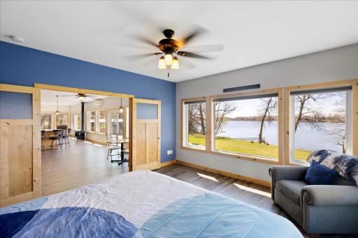 Paneled french doors into the primary bedrooms.