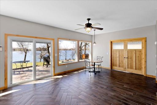 Dining room area has LVP flooring with herring bone accent and walks out to the large patio