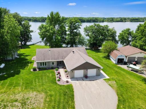 Enjoy lake life year round with a gentle slope down to your dock This single level home is ADA compliant, too. In floor heat throughout the home and garage for those cold winters!