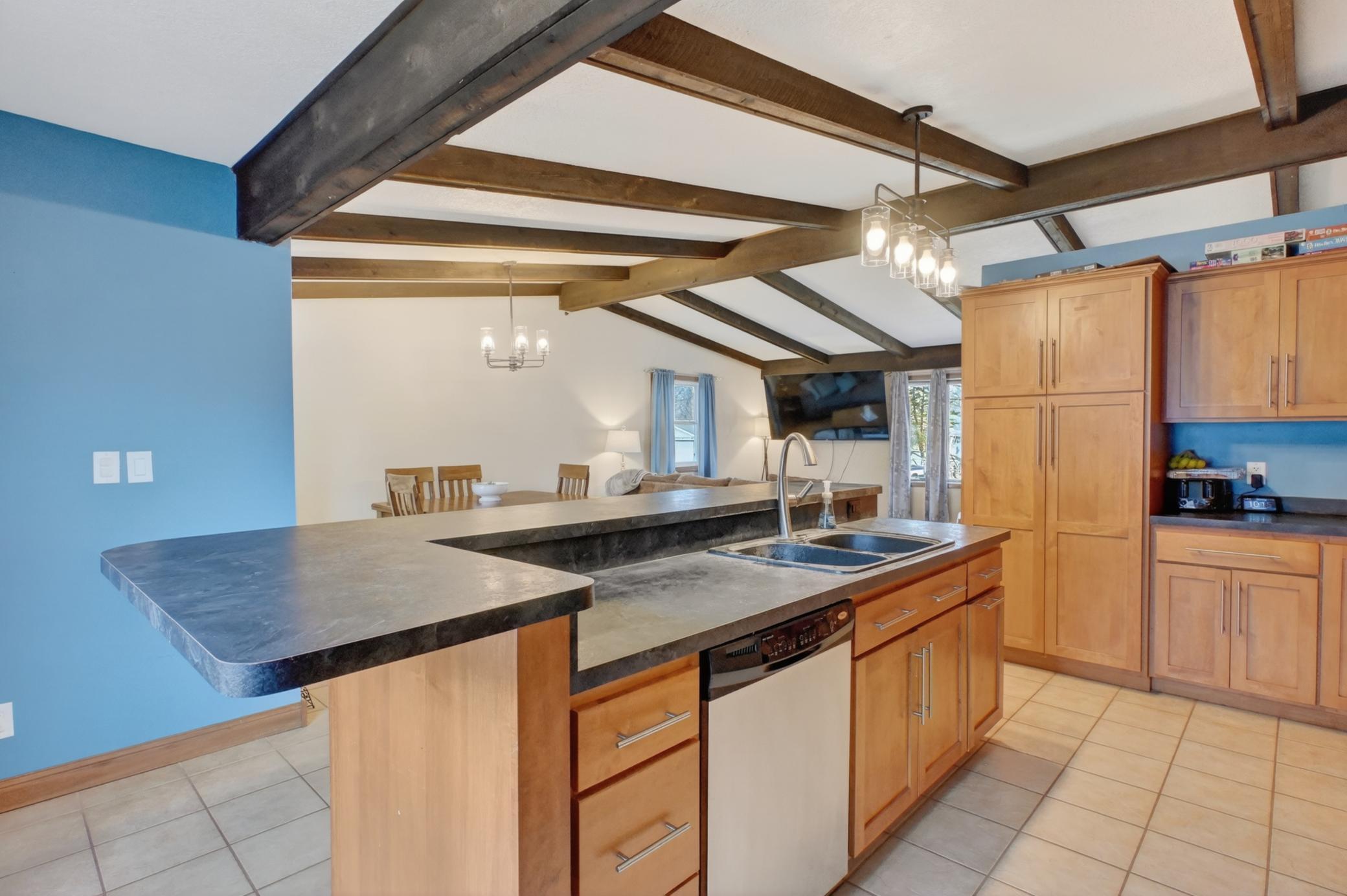 Center island with sink and dishwasher