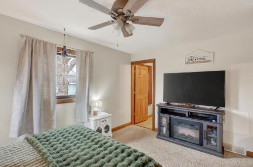 Primary bedroom with ceiling fan