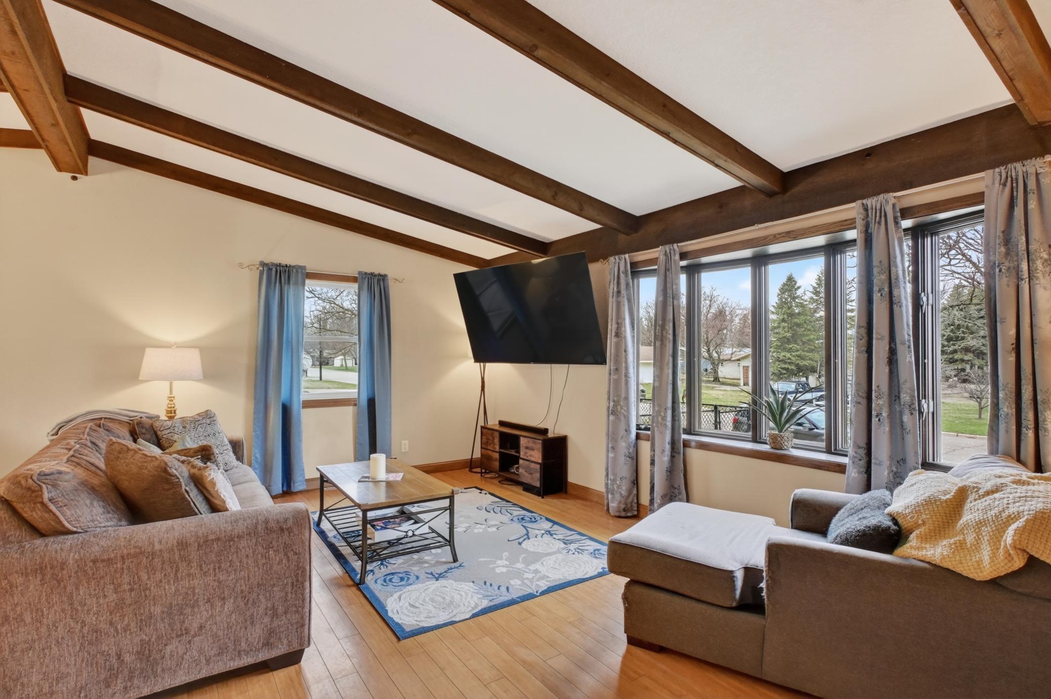 Sun filled living room with bay window