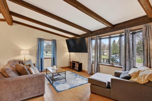 Sun filled living room with bay window