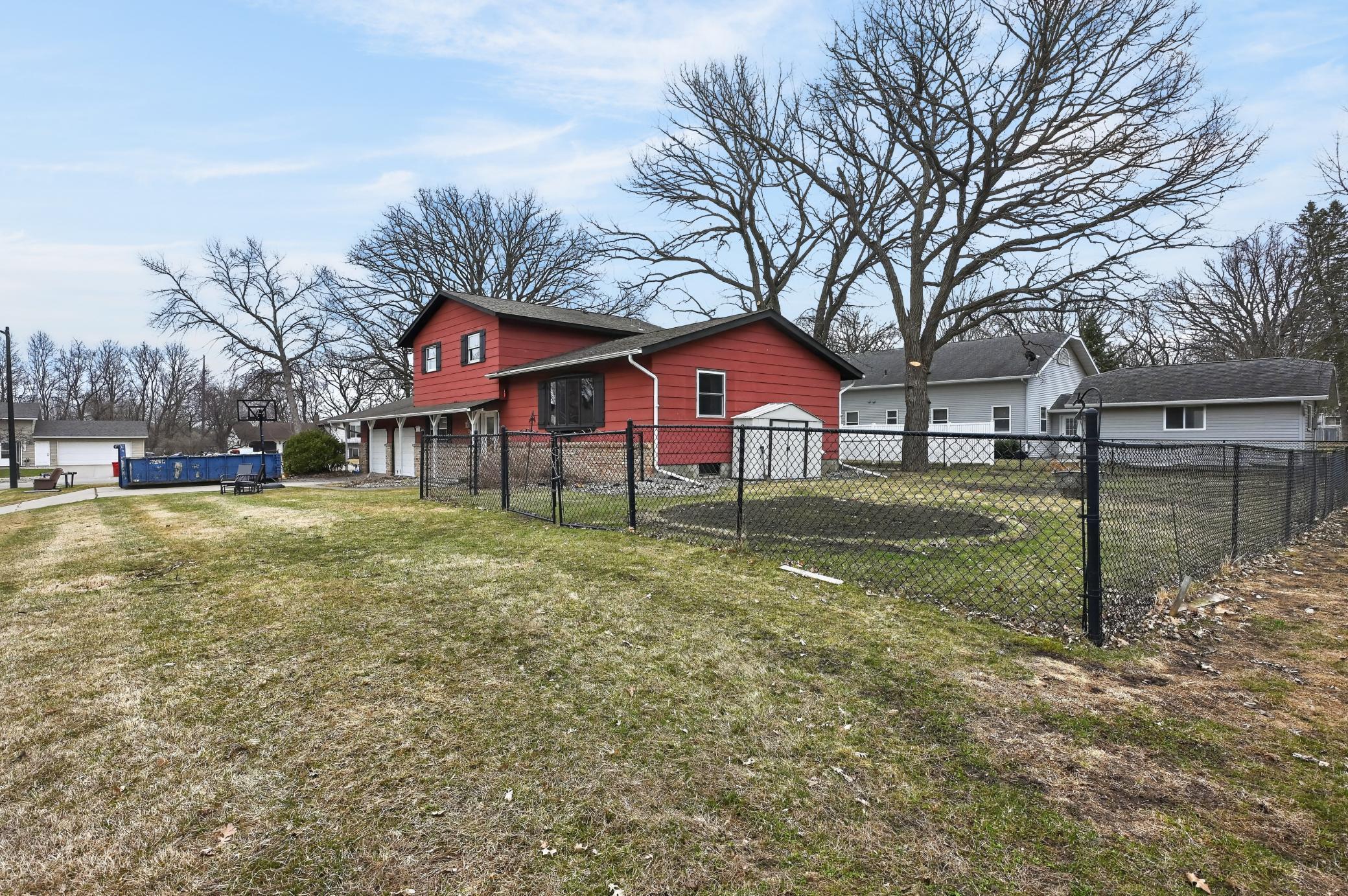 Partially fenced with black chain link