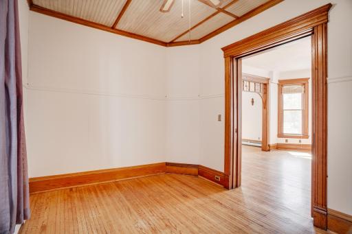 Main level bedroom looking into formal dining room