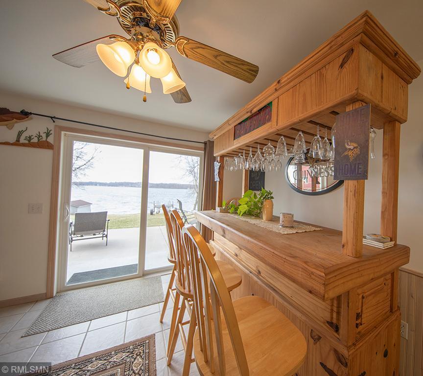 Room for guests inside and out with the spacious concrete patio just steps from the kitchen and dining areas.