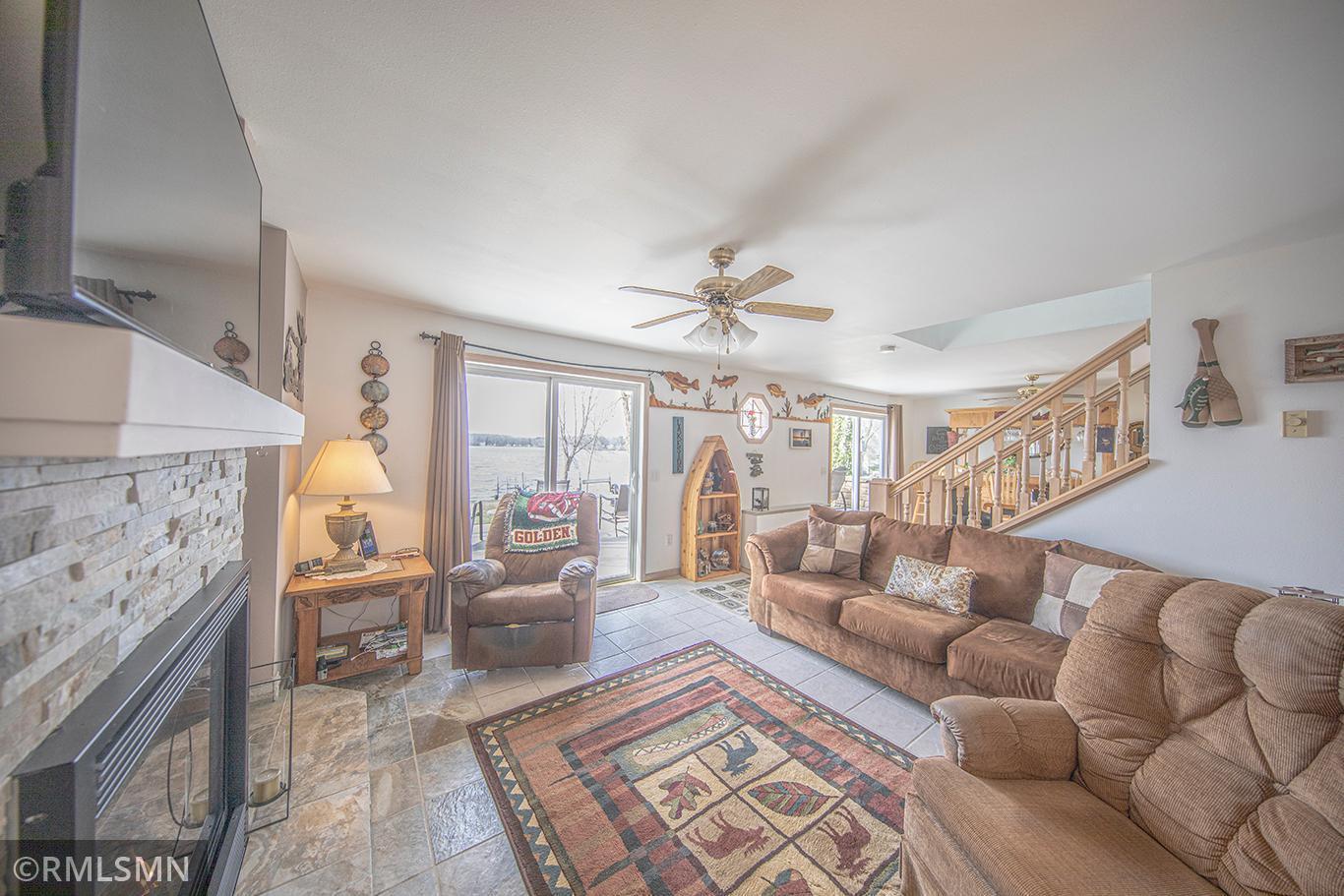 The warm and inviting living room opens to the wonders of 4 seasons of beauty.