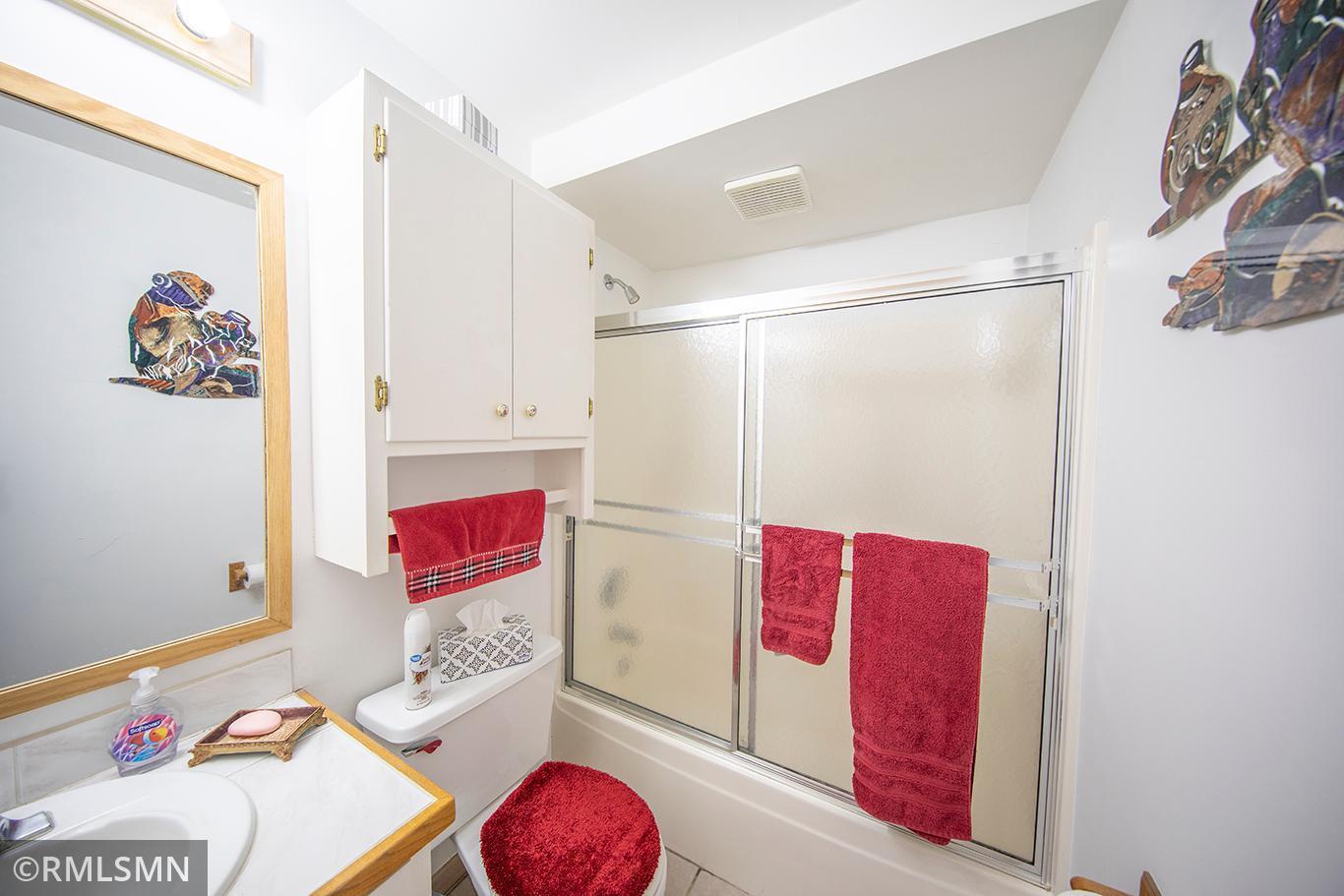 Lower level bathroom, light and bright in every room of this lakehome!