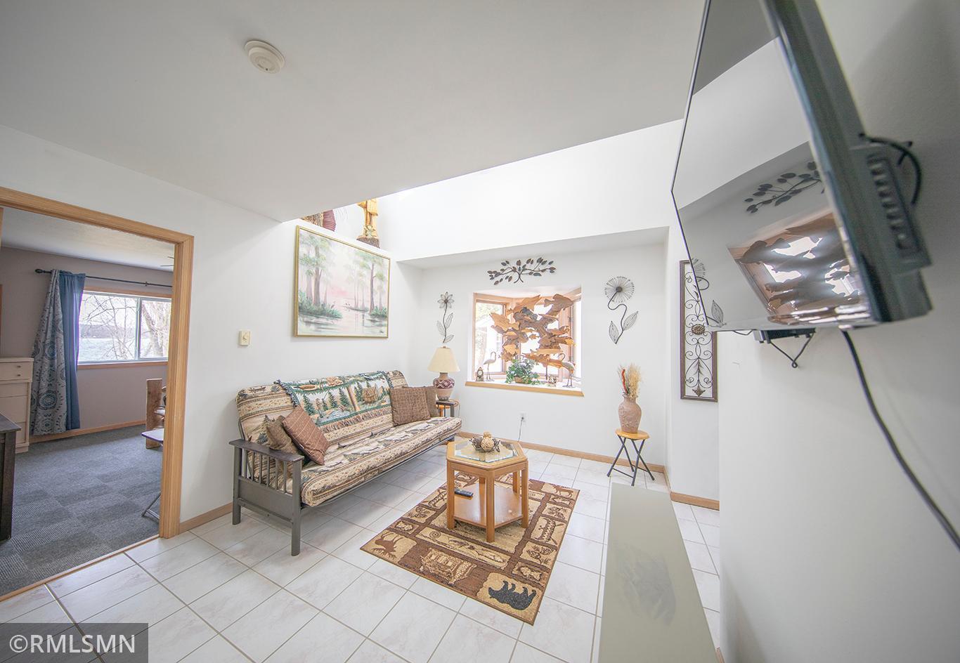The lovely upper sitting area with bay window and sidelights flooding the area with natural light