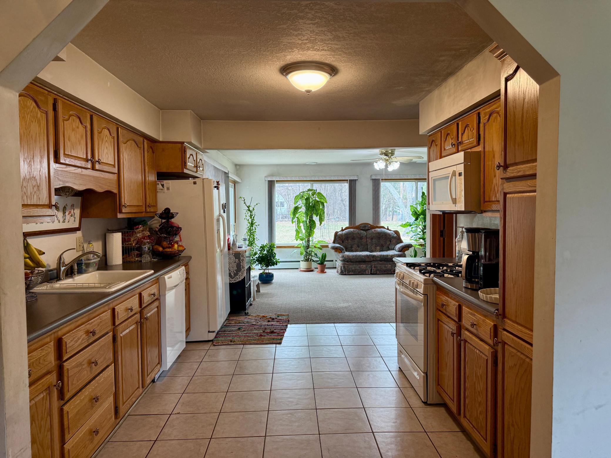 Kitchen is conveniently located in the center of the home