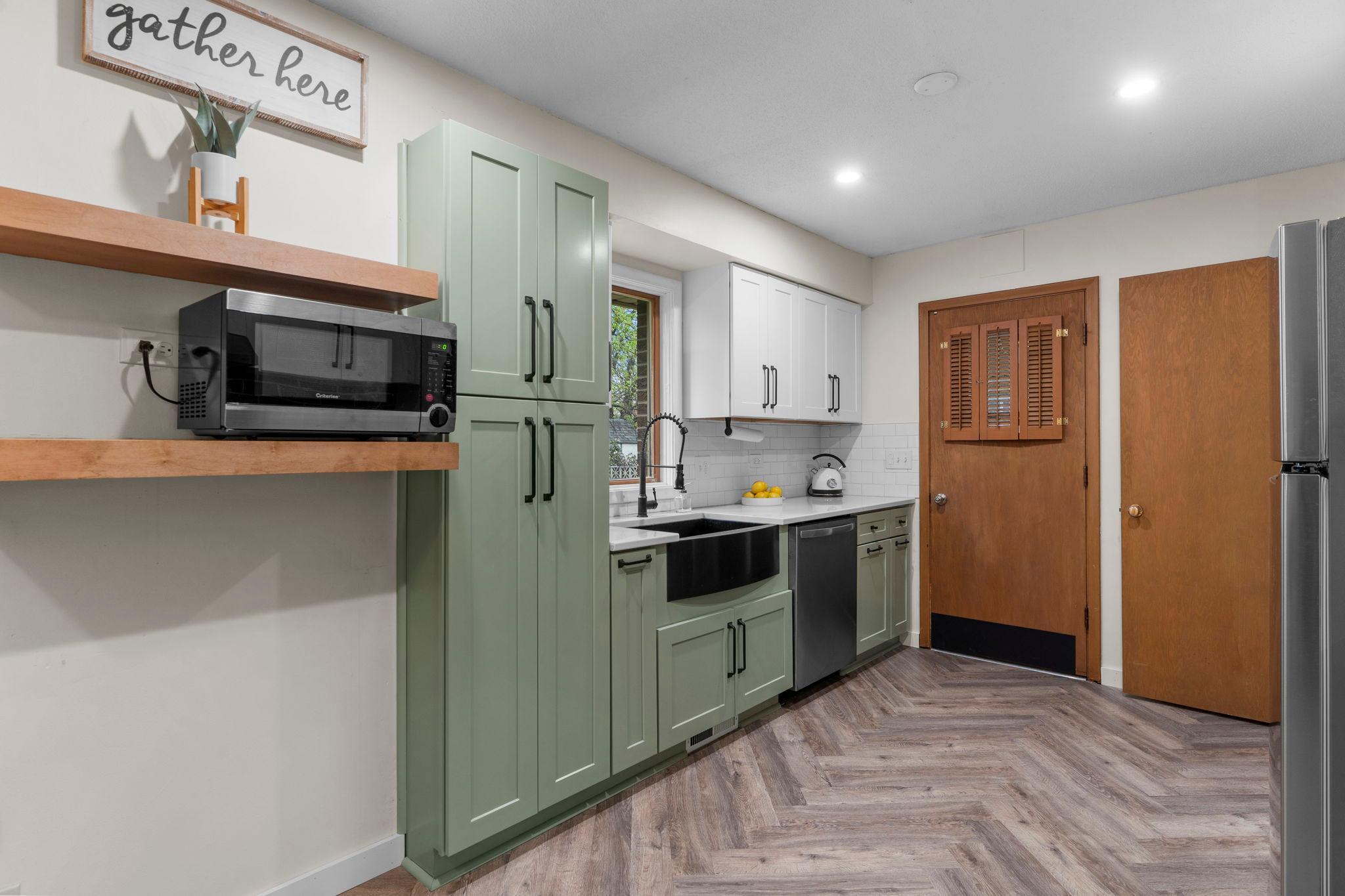 Enjoy floating shelves and tile backsplash!