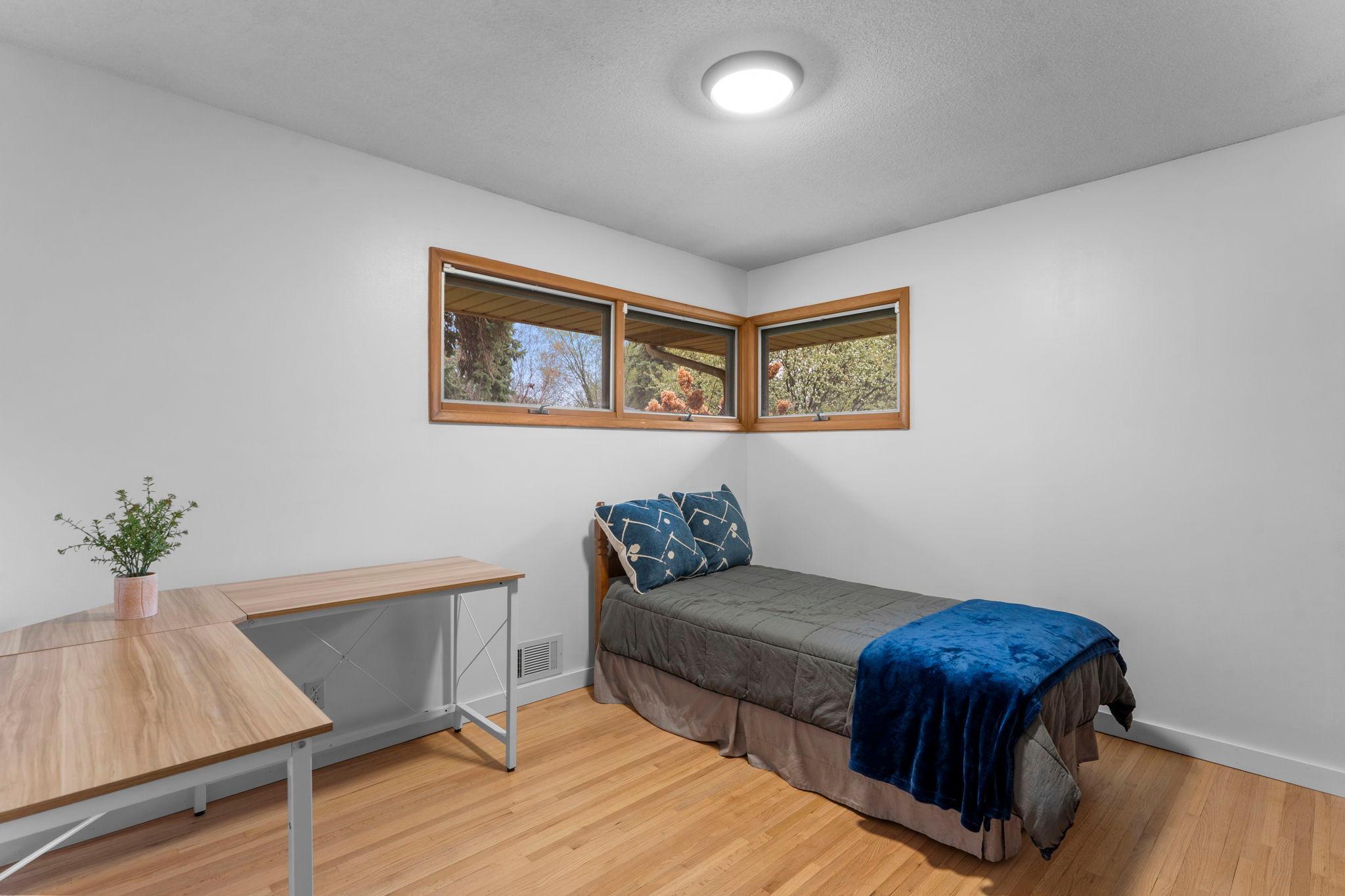 Main level room is room is ideal for bedrooms, a home office, or creative spaces.