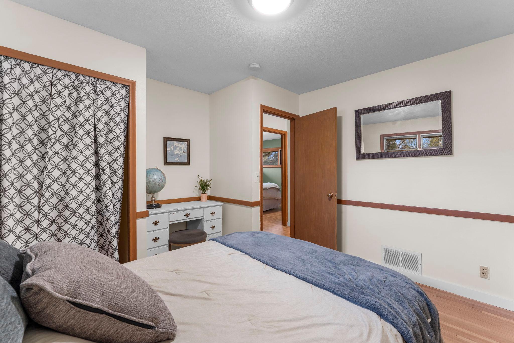 Each bedroom features continuous wood flooring, generous closet space, and great natural light.