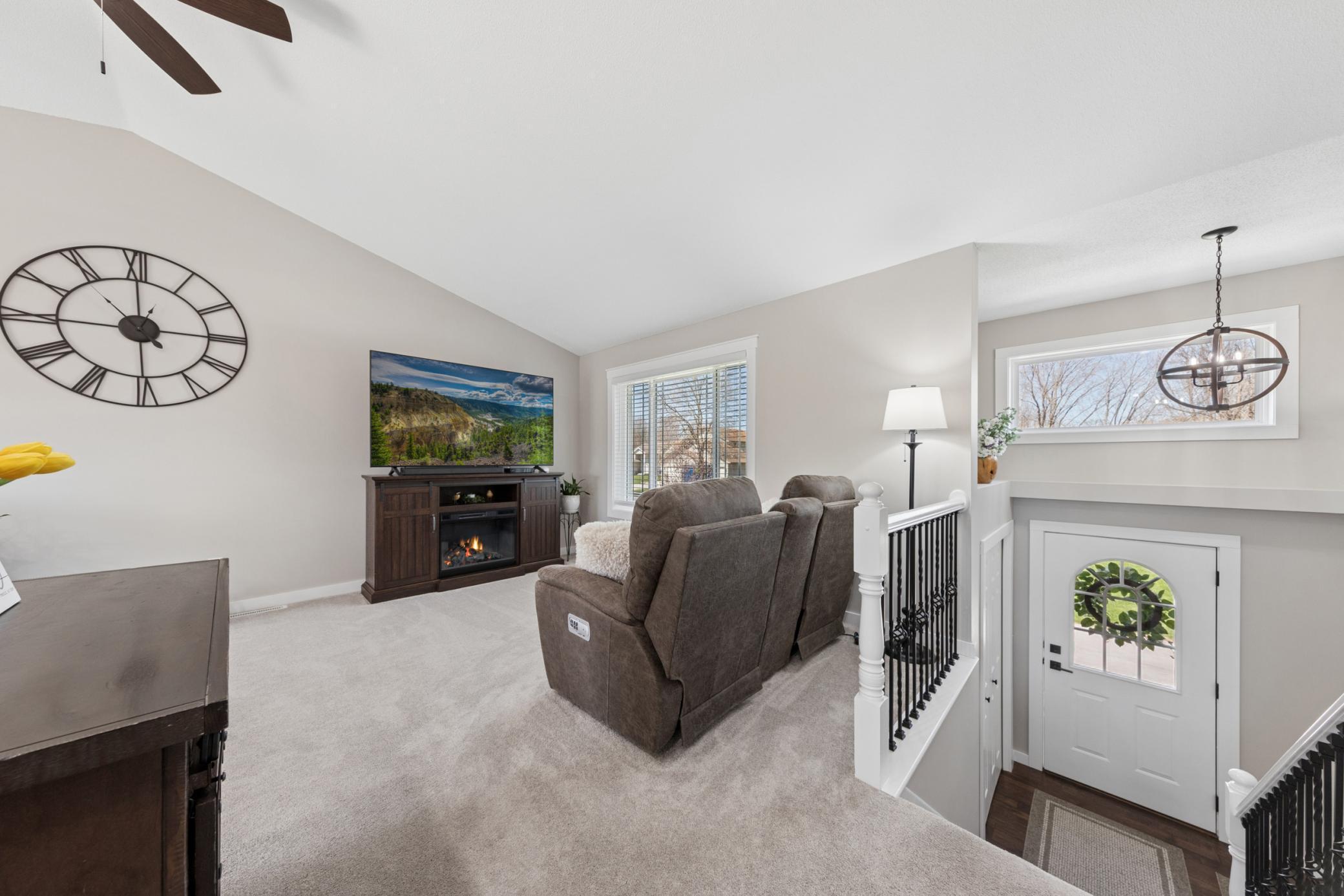 The updated living room shines with light streaming throughout.jpg