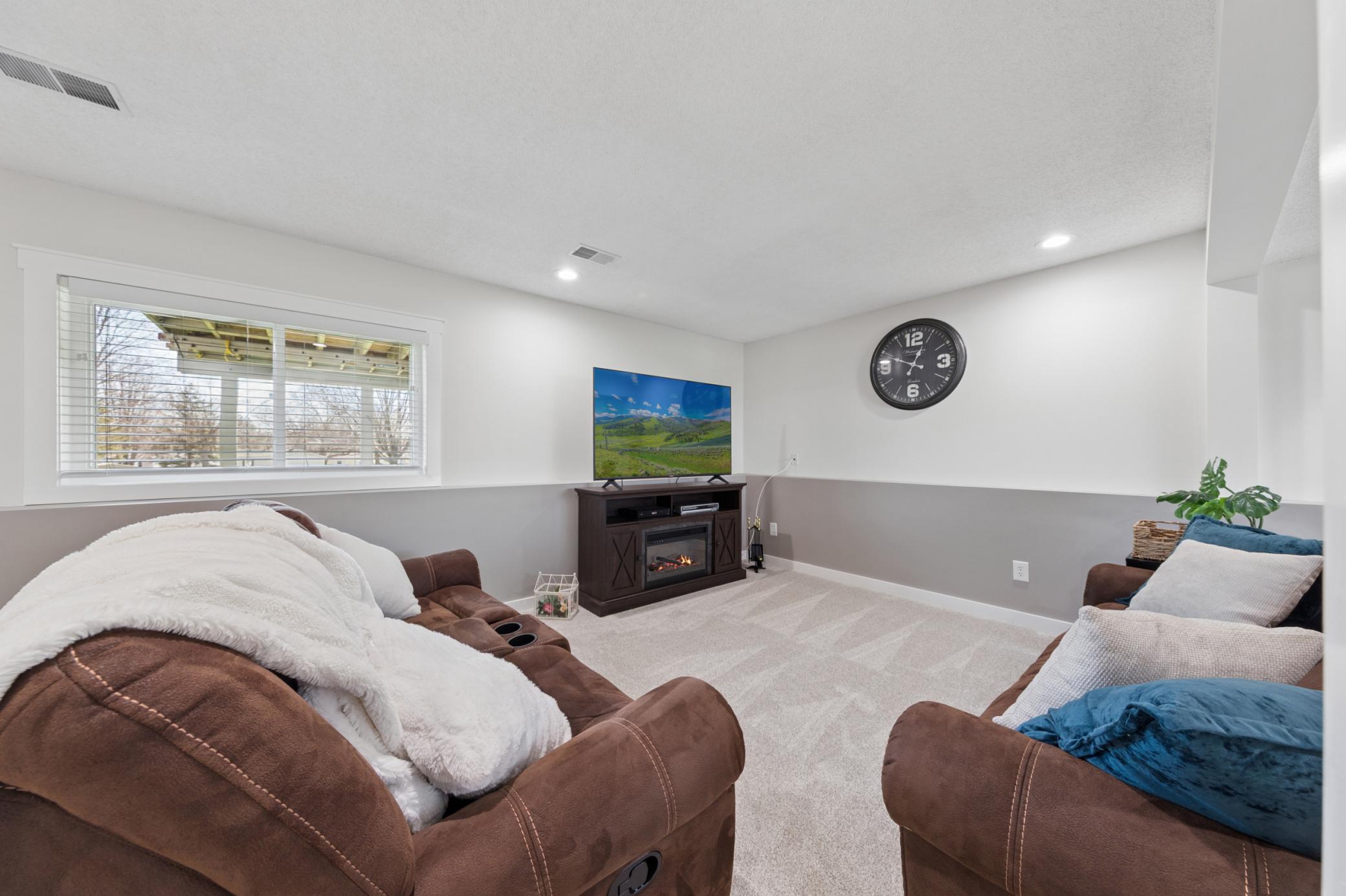 Imagine getting cozy and watching the big game in the lower level family room