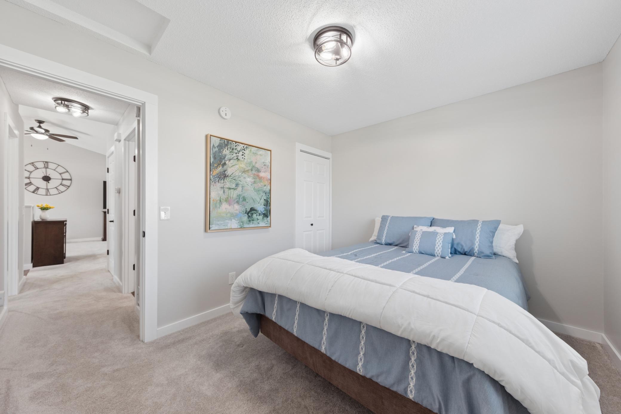 Just steps away from the main level bathroom and with a large closet, this bedroom is the perfect size.jpg